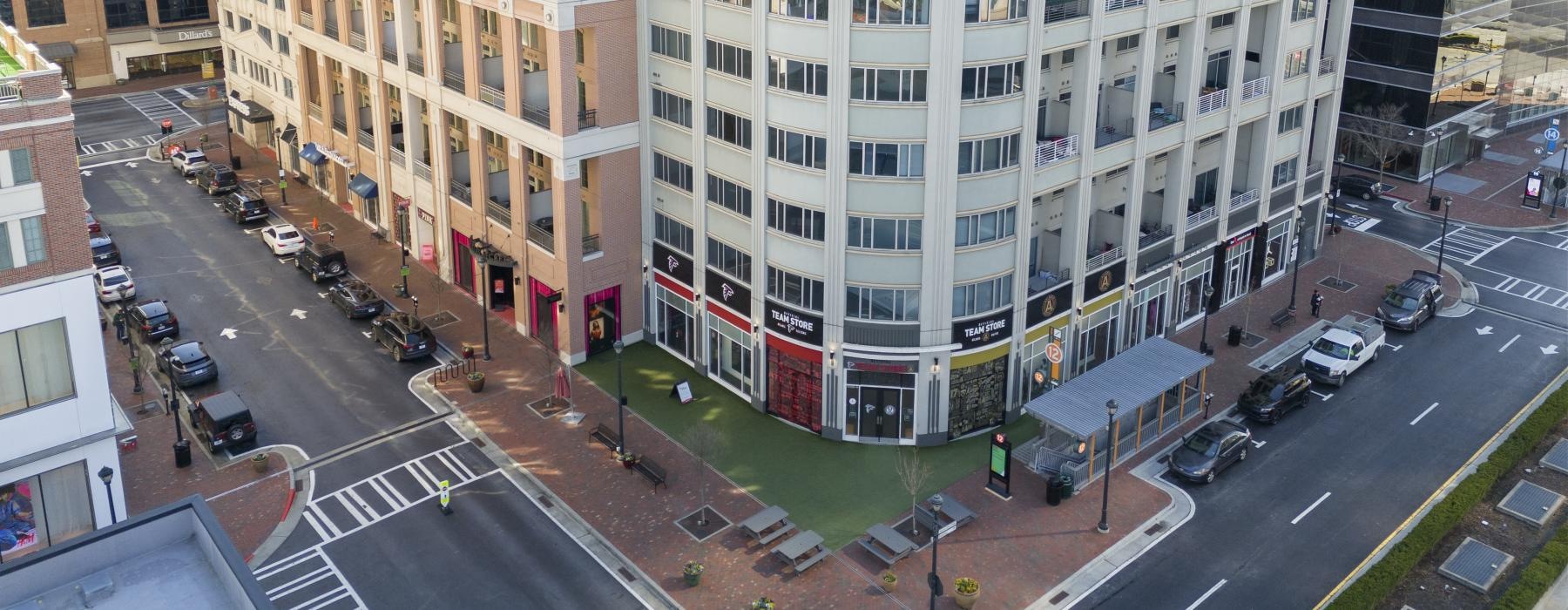 a street with cars and buildings