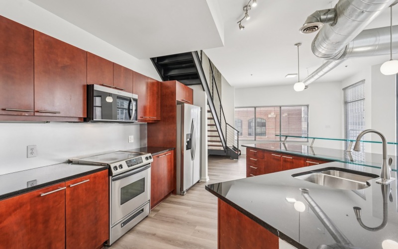 Kitchen with wooden floors and bright lighting
