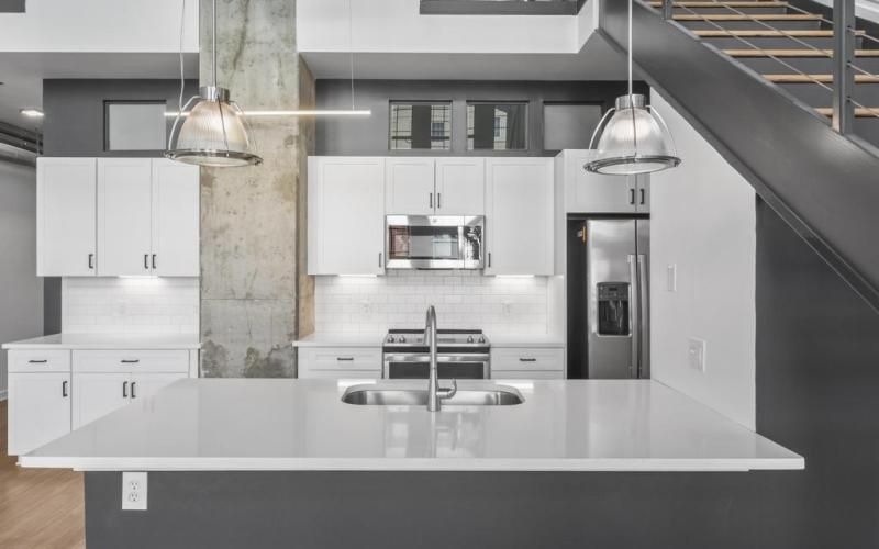 a kitchen with white cabinets